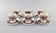 Raija Uosikkinen for Arabia. Six Ali porcelain coffee cups with saucers. Brown 
flower decoration. 1960s.
