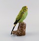 Jeanne Grut for Royal Copenhagen. Figure in hand-painted and glazed faience. 
Budgerigar. 1970s.
