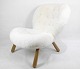 The Arctander chair known as the "muslingestolen" designed by Philip Arctander with sheepskin. A ...