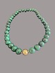 Green necklace 
with clasp in 
14 carat gold
Malachite, 
lock 14 karat 
gold
Good condition
