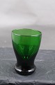Dark green absinthe glass from the first half of the 20th century from Holmegaard, Denmark. In a ...