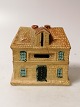 Pottery money 
box Bank Height 
10,5cm Length 
10,5cm Width 
6,5cmFread with 
repair