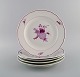 Five rare Meissen dinner plates in hand-painted porcelain with purple flowers. 
Early 20th century.
