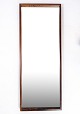 Mirror made of rosewood in Danish design from the 1960s.Dimensions in cm: H:105 W:40