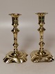 A pair of stamped brass baroque candlesticks both double stamped Height 18.5cmA light pipe with ...