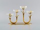 Gunnar Ander for Ystad Metall. Candlestick in brass and clear art glass shaped like flowers. ...