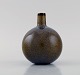 Carl Harry Stålhane (1920-1990) for Rörstrand. Round vase with narrow neck in 
glazed ceramics. Beautiful speckled glaze. Mid-20th century.

