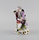 Meissen, Germany. Antique hand-painted porcelain figure. Noble boy with book. 
Approx. 1900.
