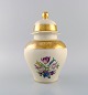 Rosenthal 
lidded vase in 
cream-colored 
porcelain with 
hand-painted 
flowers and 
gold leaf ...