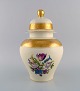 Large Rosenthal 
lidded vase in 
cream-colored 
porcelain with 
hand-painted 
flowers and 
gold leaf ...