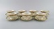 KPM, Berlin. 
Seven Royal 
Ivory tea cups 
with saucers in 
cream-colored 
porcelain with 
gold ...
