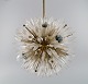 Emil Stejnar for Rupert Nikoll. Impressive ceiling lamp in brass and art glass shaped like ...