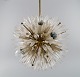 Emil Stejnar 
for Rupert 
Nikoll. 
Impressive 
ceiling lamp in 
brass and art 
glass shaped 
like ...