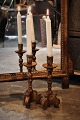 A pair of old French wooden candlesticks with old gold plating and a fine patina. Height:26cm.