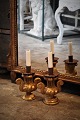 A pair of old 
1800 century 
French gilded 
wooden 
candlesticks 
with candle 
holder in metal 
and ...