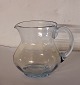 Kande i søblåt 
glas fra Fyens 
Glasværk. I god 
stand uden 
skader eller 
reparationer. 
H. 12½ cm