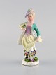 Meissen, 
Germany. 
Antique 
hand-painted 
porcelain 
figure. Lady 
with flowers. 
Late 19th ...