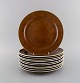 Stig Lindberg for Gustavsberg. 11 Coq dinner plates in glazed stoneware. 
Beautiful glaze in brown shades. Swedish design, 1960s.

