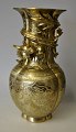 Chinese bronze 
vase, 20th 
century. Top 
decorated with 
vicious dragon. 
Corpus richly 
decorated ...