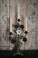 Old French church candlestick in dark patina decorated with 1 old white opaline glass flowers ...