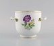 Meissen vase / flowerpot in hand-painted porcelain with flowers and gold edge. Handles modeled ...