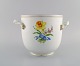 Meissen wine / 
champagne 
cooler in 
hand-painted 
porcelain with 
flowers and 
gold edge. 
Handles ...