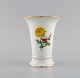 Meissen porcelain vase with hand-painted flowers and gold edge. 1920s.Measures: 14 x 11.7 ...