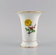 Meissen 
porcelain vase 
with 
hand-painted 
flowers and 
gold edge. 
1920s.
Measures: 14 x 
11.7 ...