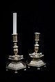 A pair of 1700 century candlesticks in solid brass with fine patina. Height 24cm. Foot, 6 ...