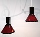 A pair of 
pendants from 
Holmegaard in 
reddish colors 
from around the 
1950s.
Measurements 
in cm: ...