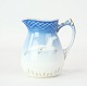 Cream jug in 
seagull frame 
with gold rim 
from Bing & 
Grøndahl 
porcelain.
Dimensions in 
cm: H:9 ...