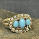 Size 55.Finger ring in gold with 3 oval turquoises surrounded by small pearls and red ...