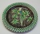 Ceramic dish, 
Humlebæk, 
Denmark. White 
base with 
liveries in 
brown, yellow, 
blue and green. 
...