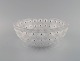 René Lalique art deco Nemours bowl in frostedart glass modeled with flowers. Mid 20th ...