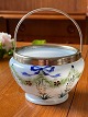Antique sugar bowl in opal glass with mounting and handle of metal. Motif with flowers and bow. ...