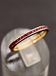 18 carat narrow gold ring size 56 with numerous rubies item no. 499743