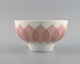 Bjørn Wiinblad for Rosenthal. Lotus porcelain service. Bowl decorated with pink 
lotus leaves. 1980s.
