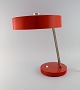Large adjustable desk lamp in original red lacquer. 1970's.Height: 43 cm.Foot diameter: 20 ...
