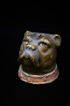 Old ceramic piggy bank in the form of dogs head with old paint and fine patina. H:8,5cm. 8x8cm.