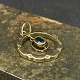 Diameter 1.8 cm.Fine round pendant with a cut sapphire in the middle from the beginning of ...