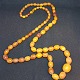 Antique 
Butterscotch 
baltic sea 
amber necklace 
with olive 
shaped beads. 
Length 72 cm. 
Weight ...