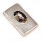 Small sterling 
silver box with 
the portrait of 
a horse
Size: 
8,3x5,1x1,3cm. 
W: 86,8gr
