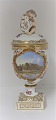Royal Copenhagen. Porcelain egg vase with putti. Motif: Botanical Garden. Height 27 cm. Produced ...