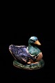 Old Swedish piggy bank in the form of duck in painted ceramic.H: 10.5cm. L: 14cm.
