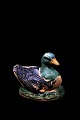 Old Swedish 
piggy bank in 
the form of 
duck in painted 
ceramic.H: 
10.5cm. L: 
14cm.