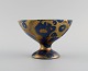 Lucien Brisdoux (1878-1963), France. Bowl on foot in glazed stoneware. Beautiful 
glaze in gold and blue shades. 1930s / 40s.
