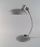 Adjustable desk 
lamp in 
original 
metallic 
lacquer. 
Industrial 
design, mid 
20th century.
Height: ...