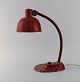 Adjustable work lamp in original red lacquer. Industrial design, mid 20th century.Height: 40 ...