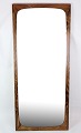 Elongated mirror made of rosewood of Danish design from around the 1960s.Dimensions in cm: ...