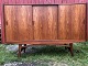 Sideboard in teak veneer with sloping legs and bar with mirror and black glass top. Danish ...